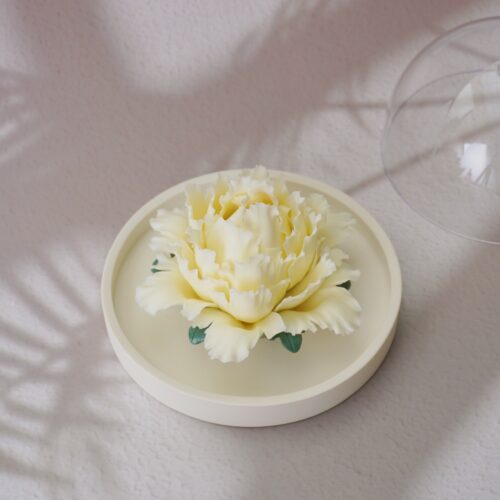 Handmade yellow ceramic peony diffuser with acrylic cover for essential oil diffusion and incense holding.