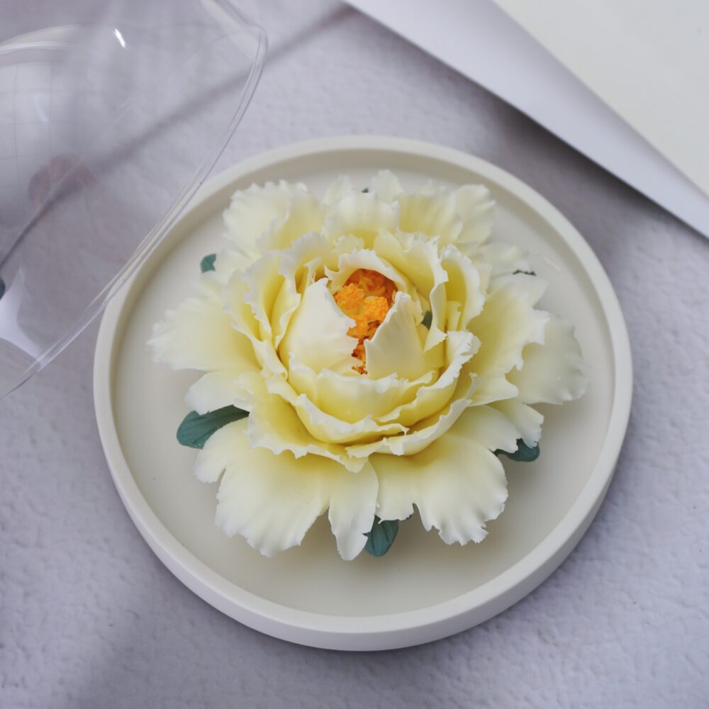 Handmade yellow ceramic peony diffuser with acrylic cover for essential oil diffusion and incense holding.